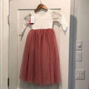Toddler girls dress in dusty mauve and white.